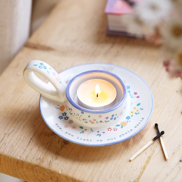 Lisa Angel Mum tealight holder with heartfelt "You Light Up Our World" message, crafted from ceramic with a handle for easy display.