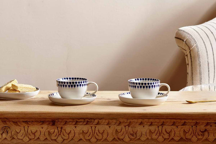 Nkuku Indigo Drop cup and saucer set with a glossy finish, featuring a modern, elegant design for stylish tea or coffee.