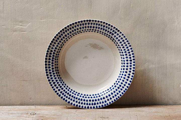 Nkuku Indigo Drop Pasta Bowl with blue and white glazing, ceramic design, perfect for serving pasta or salads.