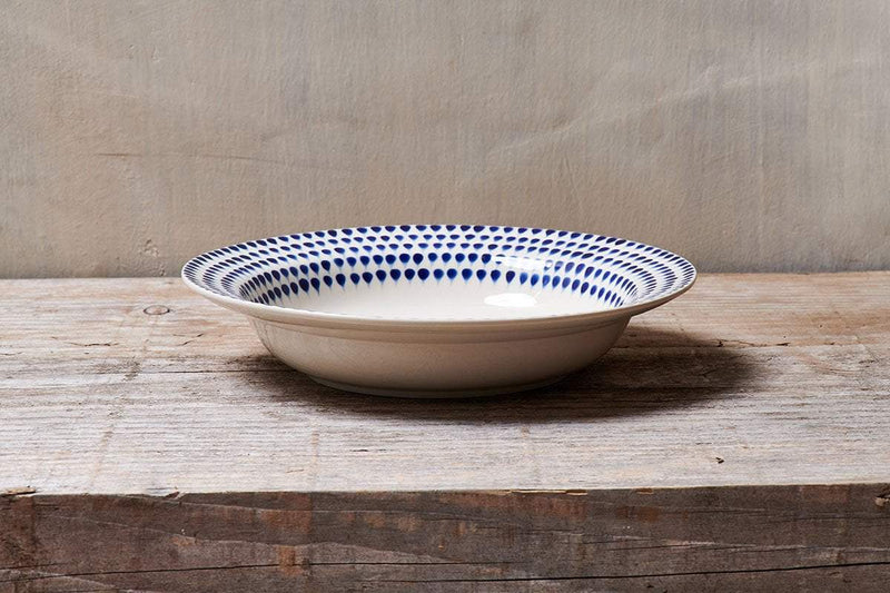 Indigo Drop Pasta Bowl by Nkuku featuring a vibrant blue ceramic design with a smooth, rounded shape perfect for serving pasta.