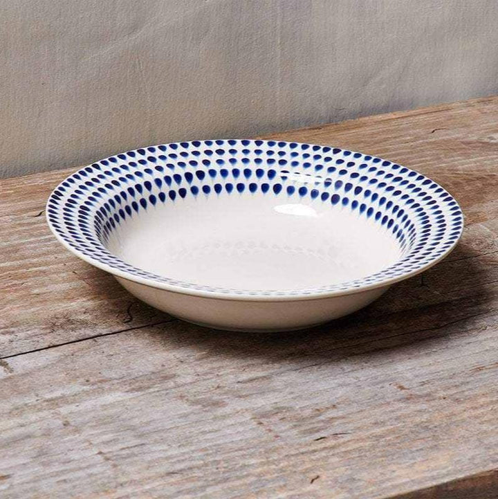 Nkuku Indigo Drop Pasta Bowl with blue and white glaze, round ceramic bowl designed for pasta or serving dishes.