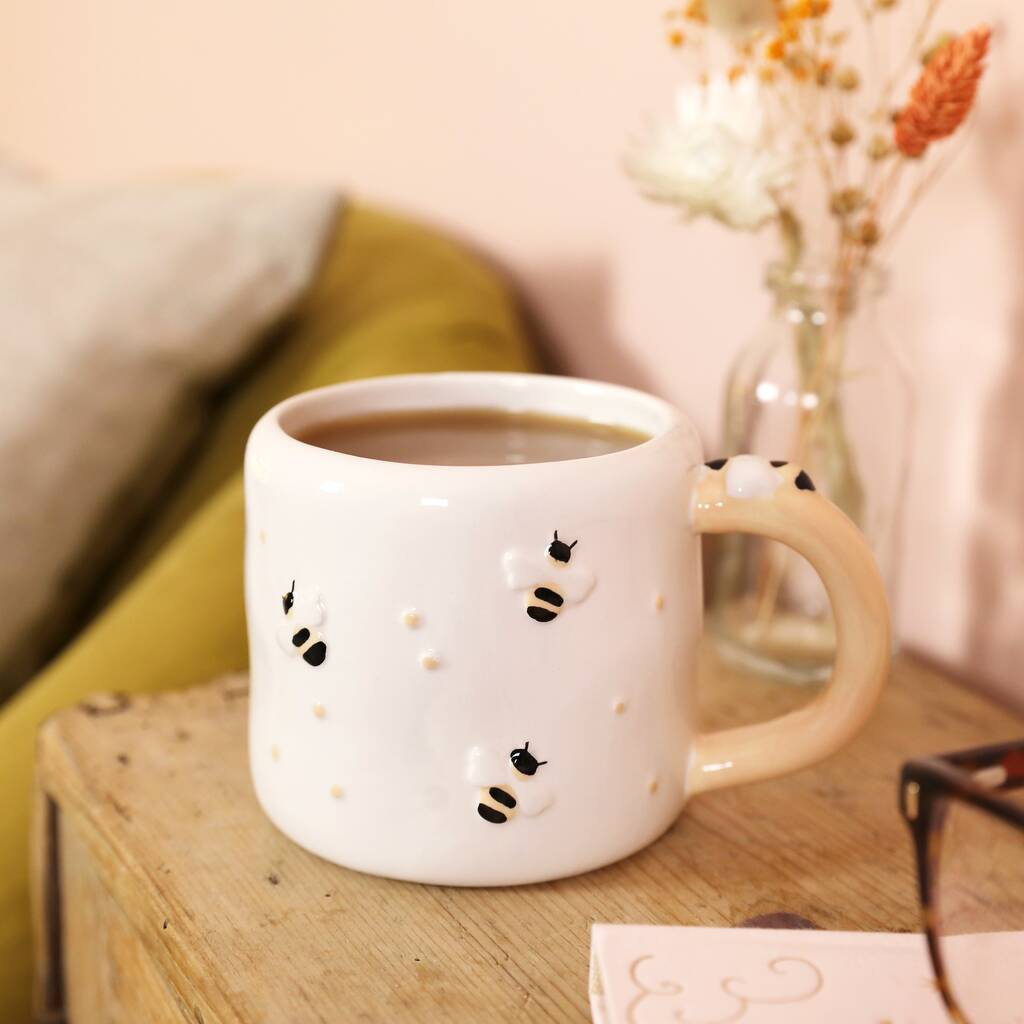 Irregular ceramic bee mug by Lisa Angel featuring a unique, handcrafted design perfect for tea or coffee.