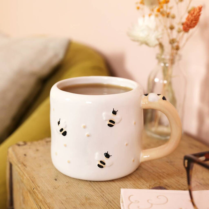 Irregular ceramic bee mug by Lisa Angel featuring a unique, handcrafted design perfect for tea or coffee.
