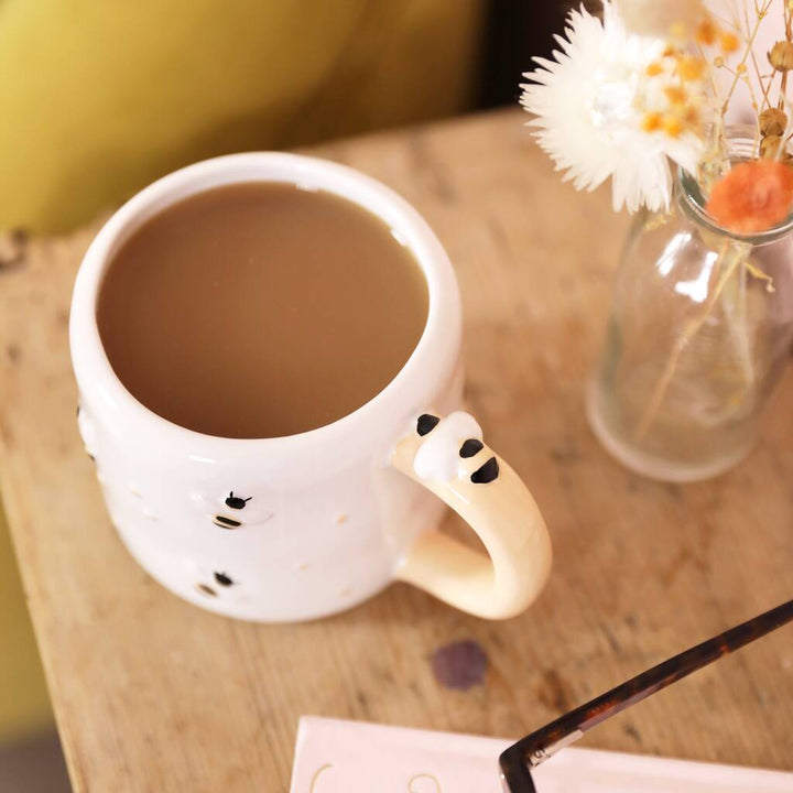 Irregular ceramic bee mug by Lisa Angel featuring a unique, handcrafted design perfect for coffee or tea.
