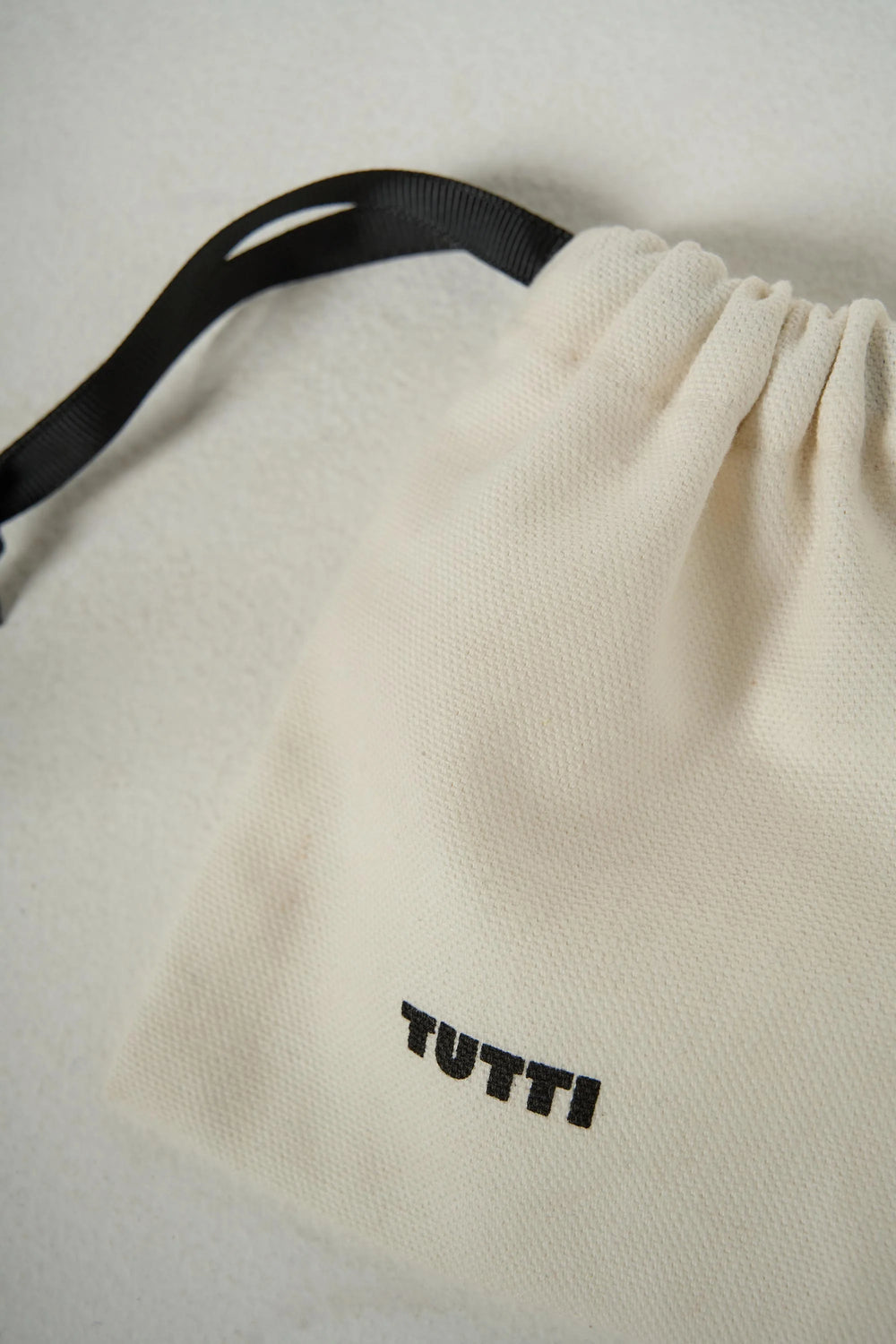 Tutti & Co Serenity Ring in a soft pouch, featuring a delicate design from Cornucopia Home and Gift.