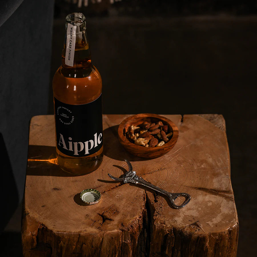 Selbrae House Highland Cow bottle opener by Cornucopia Home and Gift, featuring a detailed Highland Cow design in a lifestyle setting.