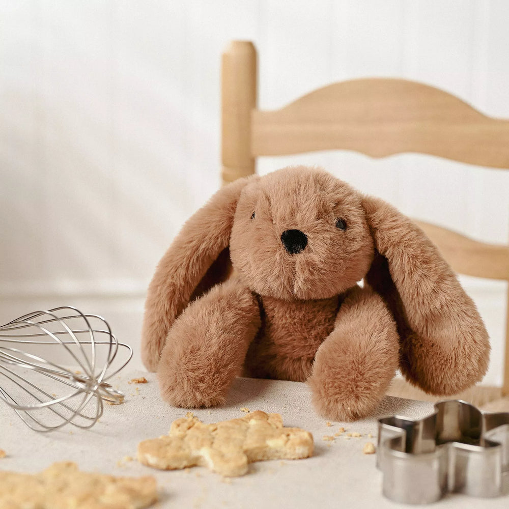 Dark brown Cookie Bunny plush softie with long legs from Widdop & Co, featuring soft, cuddly fabric and detailed bunny features.