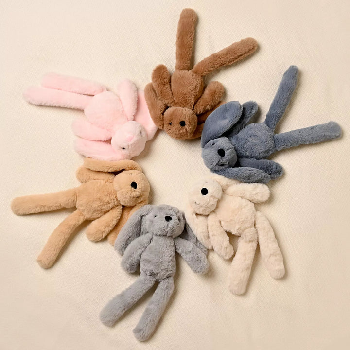 Dark brown Cookie The Bunny plush softie with long legs from Widdop &amp; Co, featuring soft, cuddly fabric and detailed bunny features.