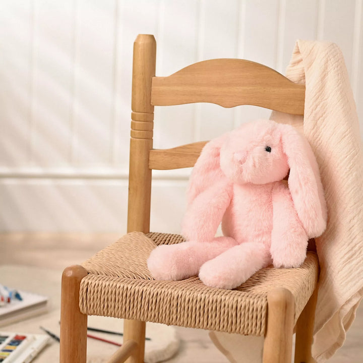 Light pink plush bunny softie named Katie with long legs by Cornucopia Home and Gift, soft and cuddly for children.