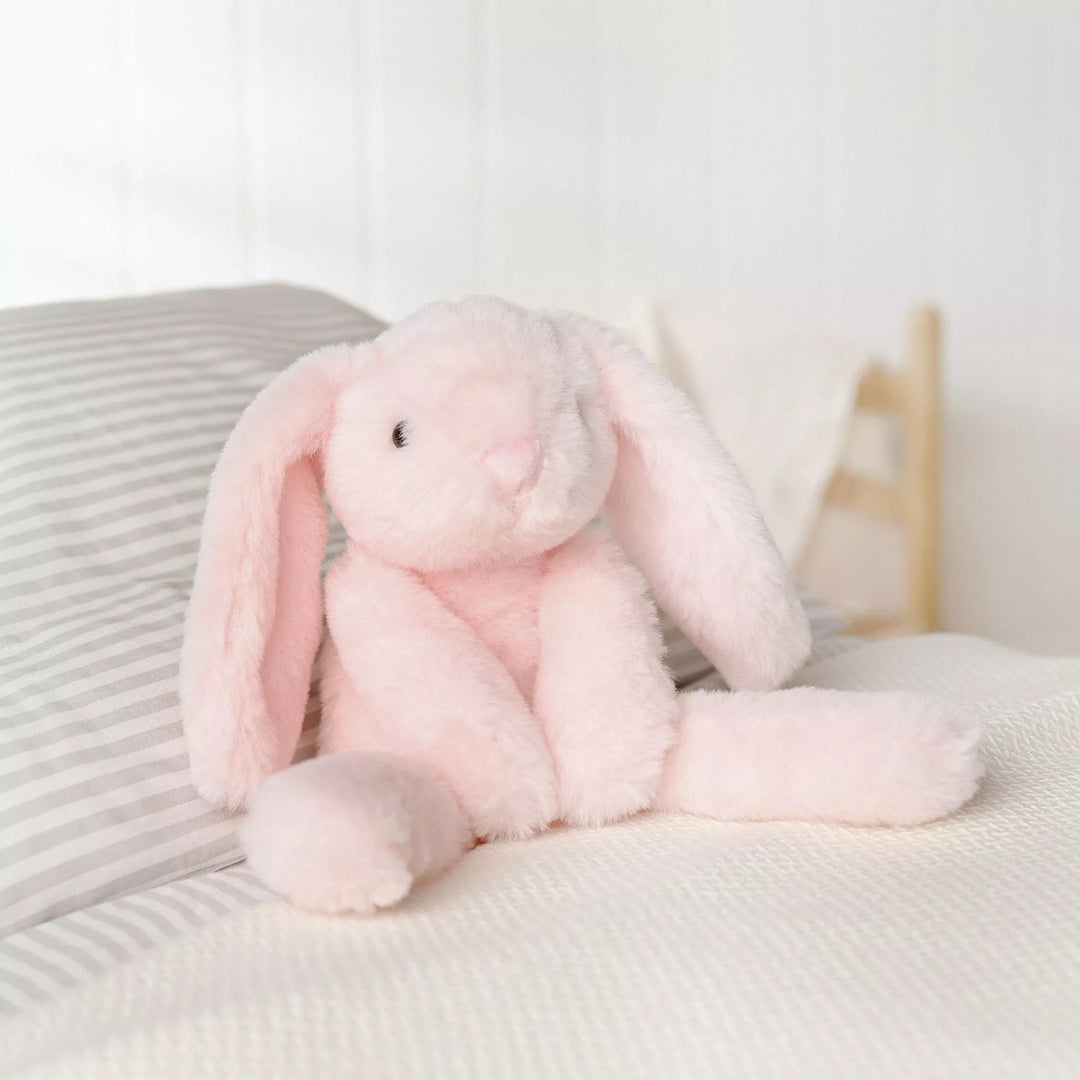 Soft pink plush bunny softie named Katie with long legs from Cornucopia Home and Gift, featuring a cute, cuddly appearance.