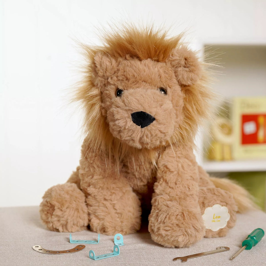 Leo the plush sitting brown lion softie by Widdop &amp; Co, a soft and cuddly plush toy perfect for children.