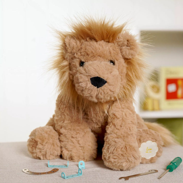 Leo the plush sitting brown lion softie by Widdop &amp; Co, a soft and cuddly plush toy perfect for children.