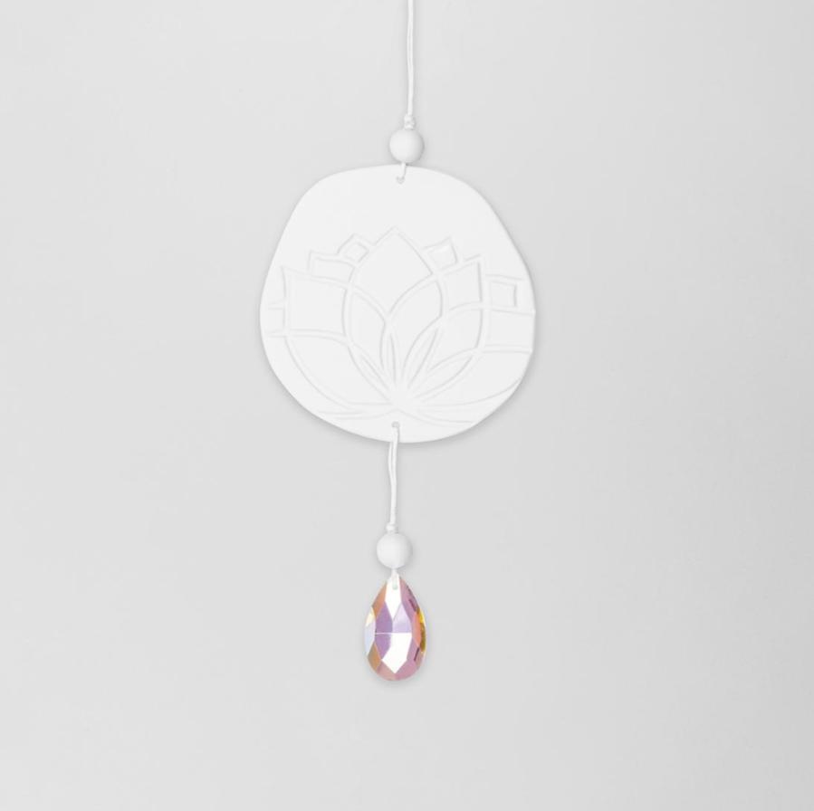 Radër Zen Spirit Suncatcher Lotus flower by Cornucopia Home and Gift, featuring a colorful lotus design hanging in the sunlight.