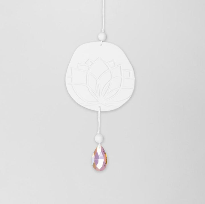 Radër Zen Spirit Suncatcher Lotus flower by Cornucopia Home and Gift, featuring a colorful lotus design hanging in the sunlight.