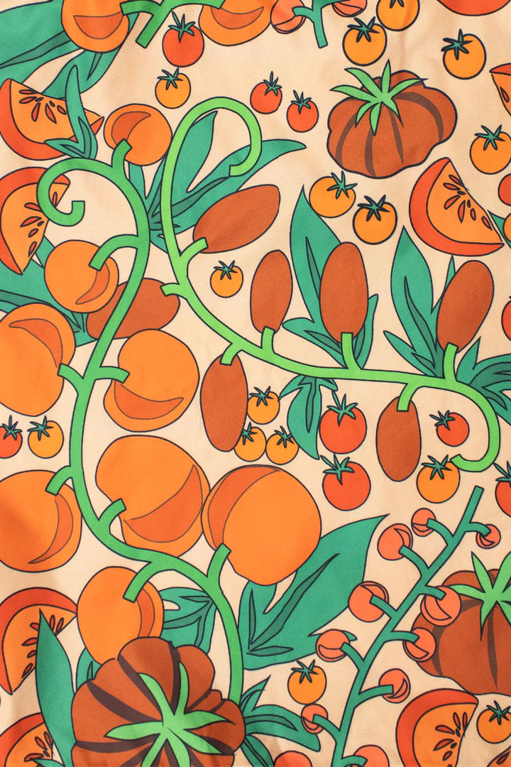 Medium reusable bag from Kind Bags by Cornucopia Home and Gift filled with fresh tomatoes on display.