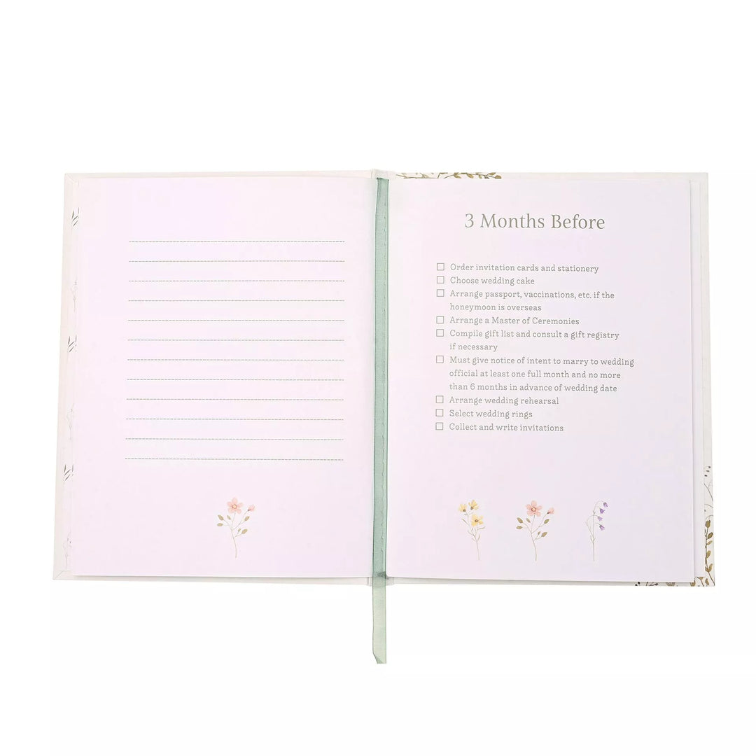 Wildflower wedding planner by Widdop &amp; Co with floral cover and spiral binding, designed for organizing wedding details.