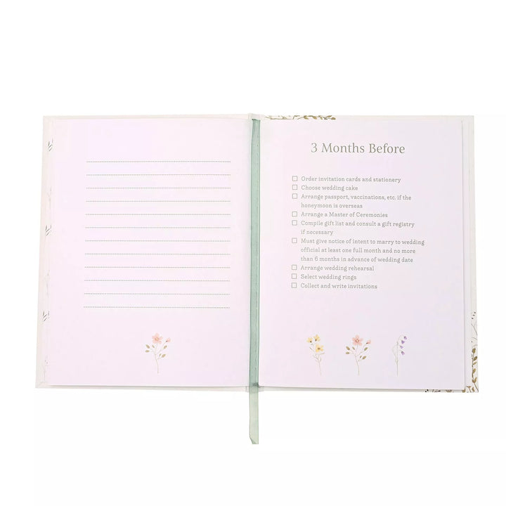 Wildflower wedding planner by Widdop &amp; Co with floral cover and spiral binding, designed for organizing wedding details.