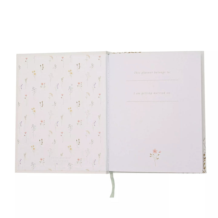 Wildflower wedding planner by Widdop &amp; Co featuring floral cover design and organized interior pages for wedding planning.