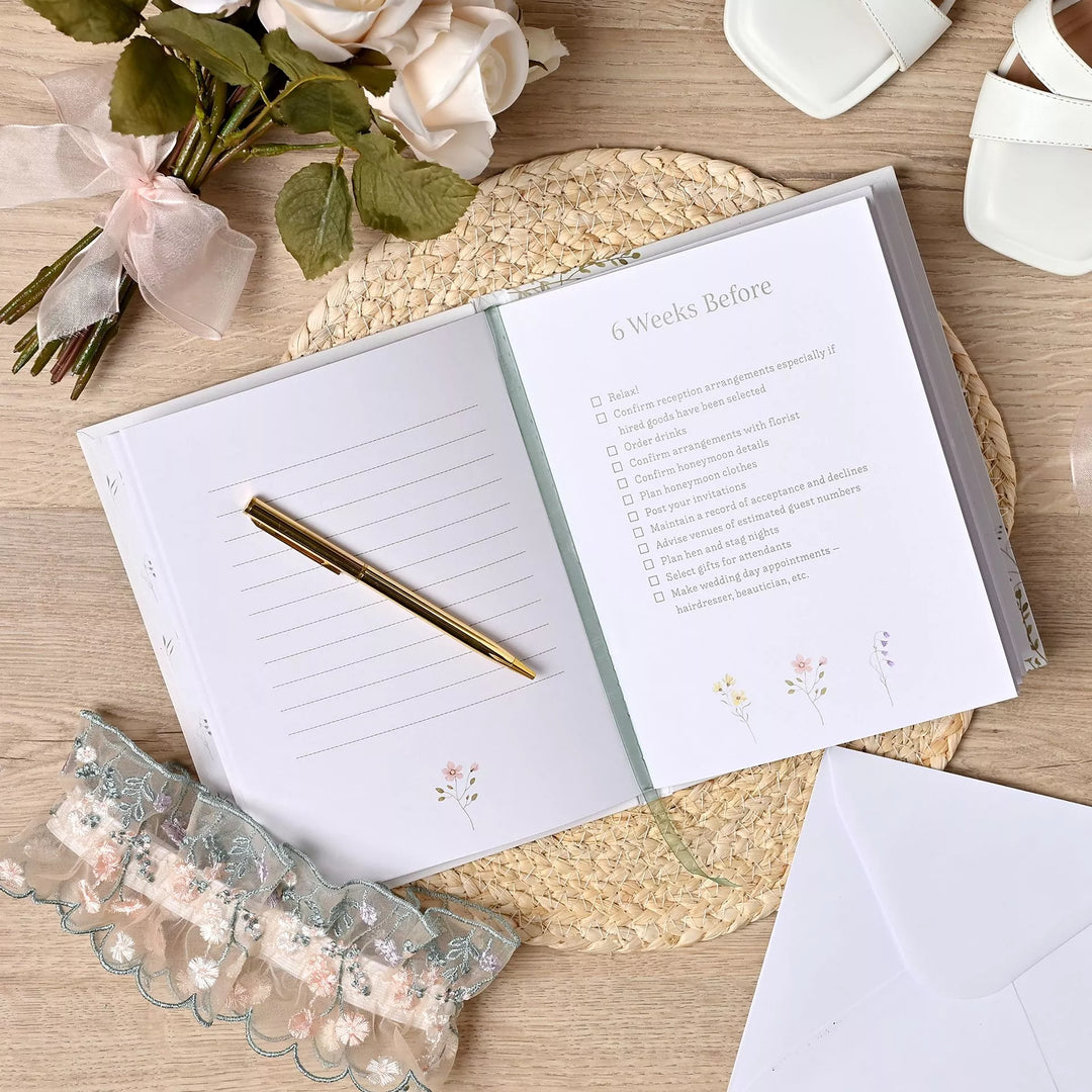 Wildflower-themed wedding planner by Widdop &amp; Co from Cornucopia Home and Gift, featuring floral design and organized pages.
