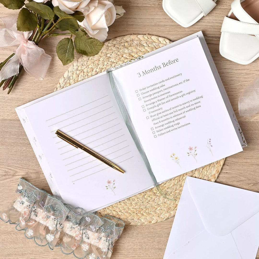 Wildflower-themed wedding planner by Widdop &amp; Co featuring floral cover design from Cornucopia Home and Gift.
