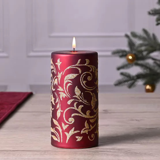 Large gold glitter pillar candle from Widdop &amp; Co Christmas collection by Cornucopia Home and Gift, decorated with festive glitter.