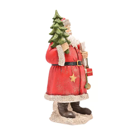 Father Christmas figurine with Christmas tree by Widdop & Co from Cornucopia Home and Gift, detailed holiday decoration.