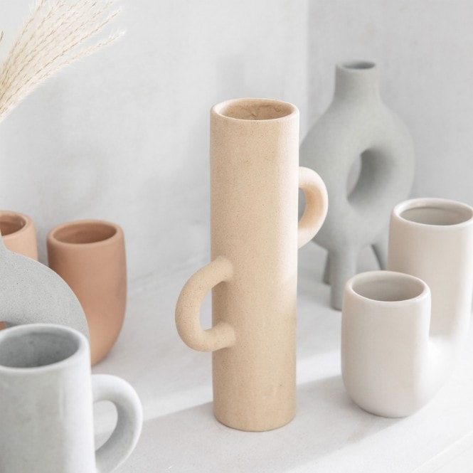 Small Sigga Oatmeal Vase by Cornucopia Home and Gift, gallery style with a textured oatmeal-colored ceramic finish.