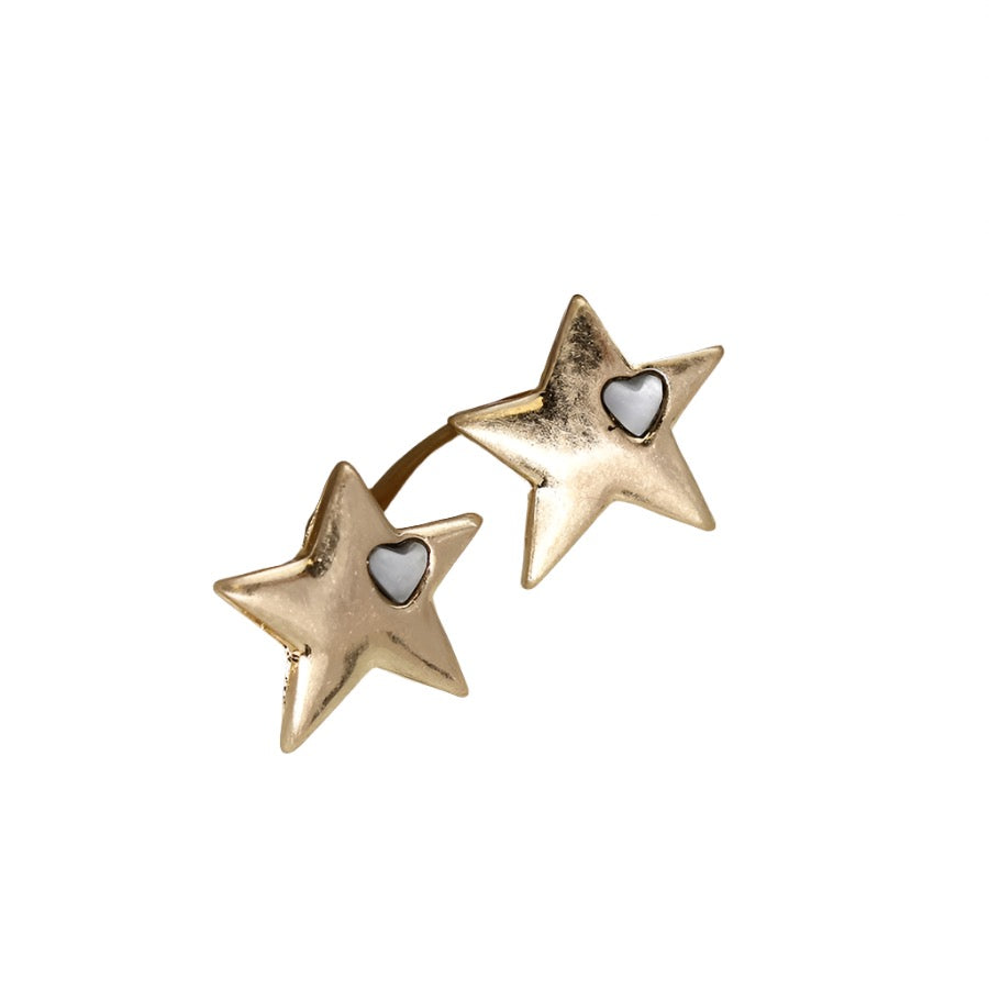 Worn gold star earrings from POM Jewellery by Cornucopia Worcester, featuring a delicate gold star design.