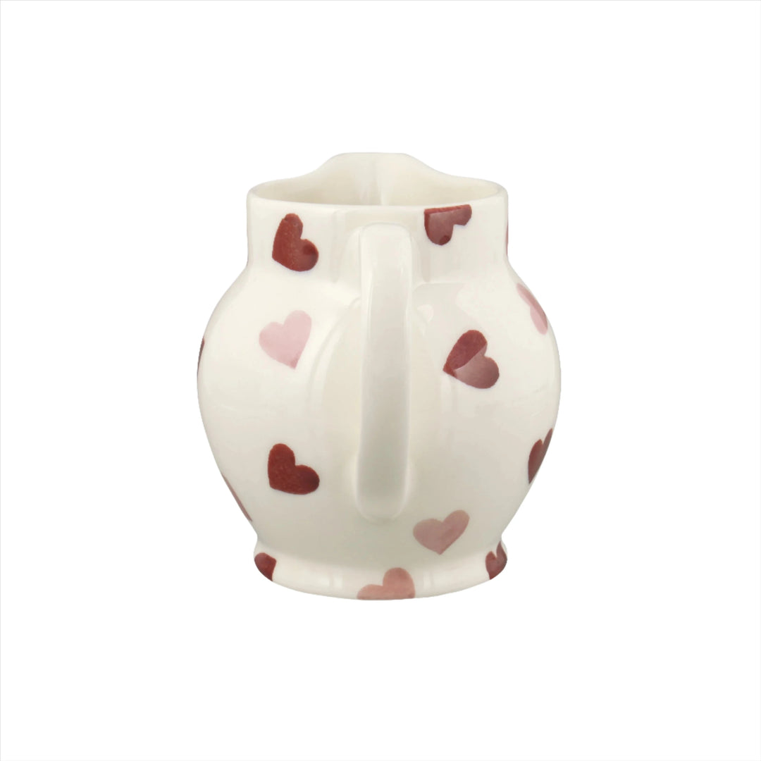 Emma Bridgewater pink hearts half pint ceramic jug with a charming pink heart pattern on a white background.