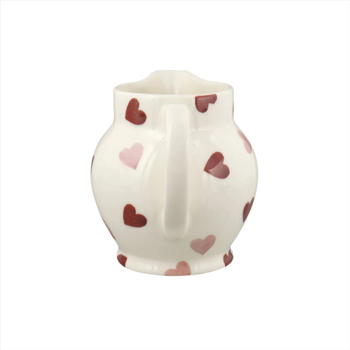 Emma Bridgewater pink hearts half pint ceramic jug with a charming pink heart pattern on a white background.