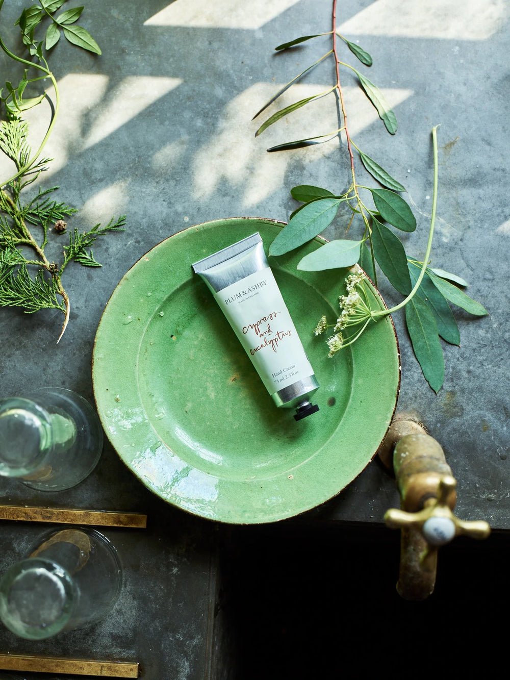 Cornucopia Home and Gift Cypress & Eucalyptus hand cream tube with botanical design and natural scent elements visible.