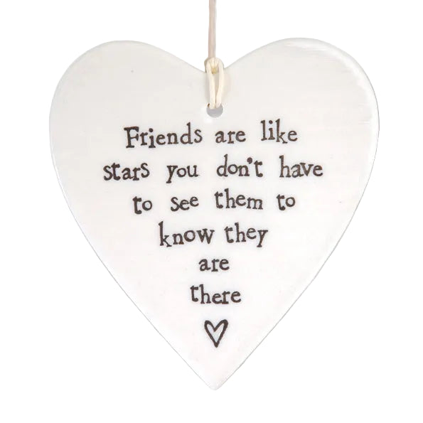 East of India porcelain hanging heart with "Friends Are Like Stars" message, round shape, white ceramic, decorative home decor piece.
