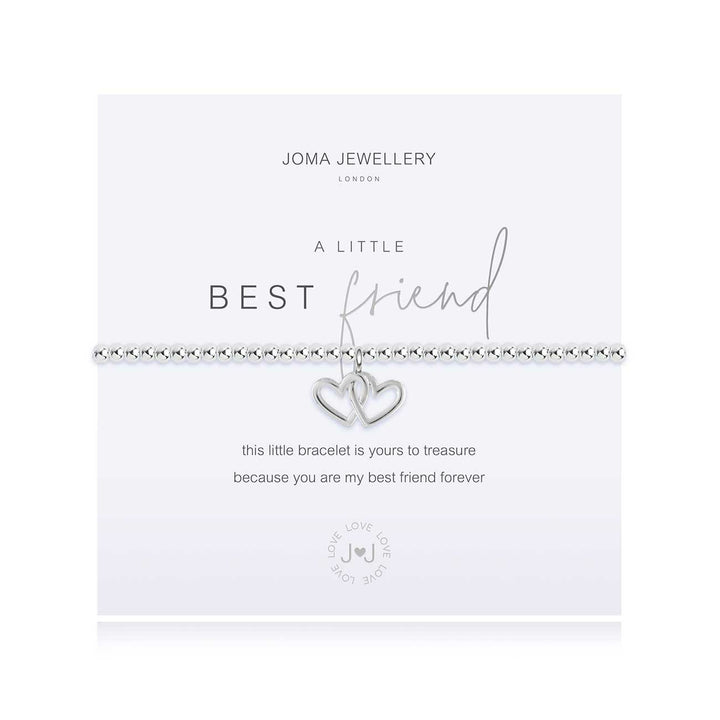 Joma Jewellery A Little Best Friend bracelet featuring a silver charm with engraved message, displayed on a soft fabric background.