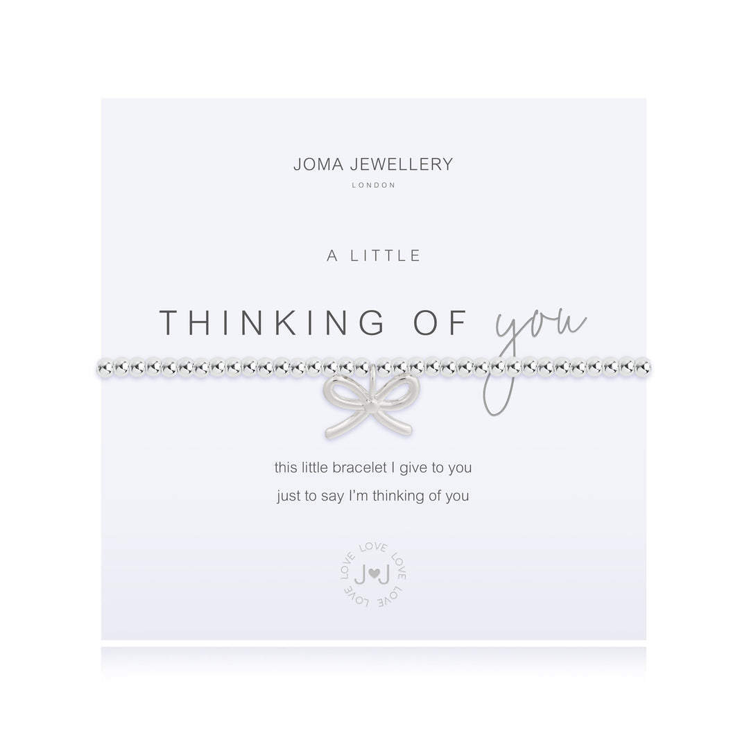 Joma Jewellery "A Little Thinking of You" bracelet with delicate silver chain and charm, styled on a neutral background.