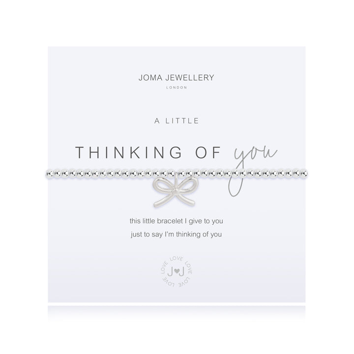 Joma Jewellery "A Little Thinking of You" bracelet with delicate silver chain and charm, styled on a neutral background.