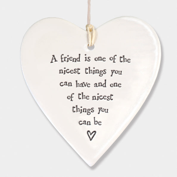 East of India porcelain round heart with "A friend is one of" inscription, decorative gift item from Cornucopia Home and Gift.