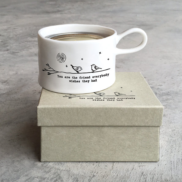 East of India porcelain tea light holder with "You Are the Friend" inscription, featuring a delicate handle and elegant design.