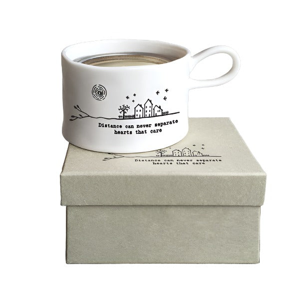 East of India porcelain tea light holder with "Distance Can Never Separate" message and hand-painted floral design.