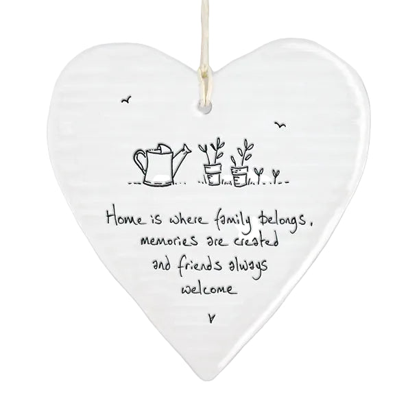 East of India porcelain hanging heart with "Home Is Where the Family Belongs" message, round wobbly design, decorative home decor.