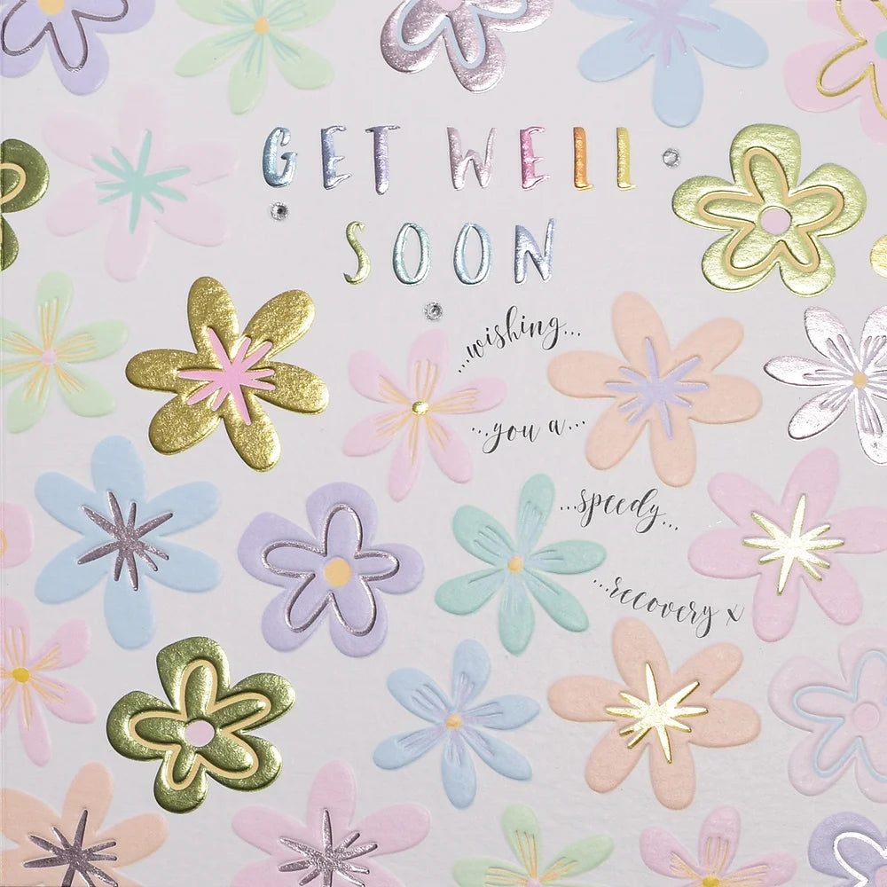 Get Well Soon flowers arrangement by Wendy Jones-Blackett featuring colorful blooms in a decorative display.