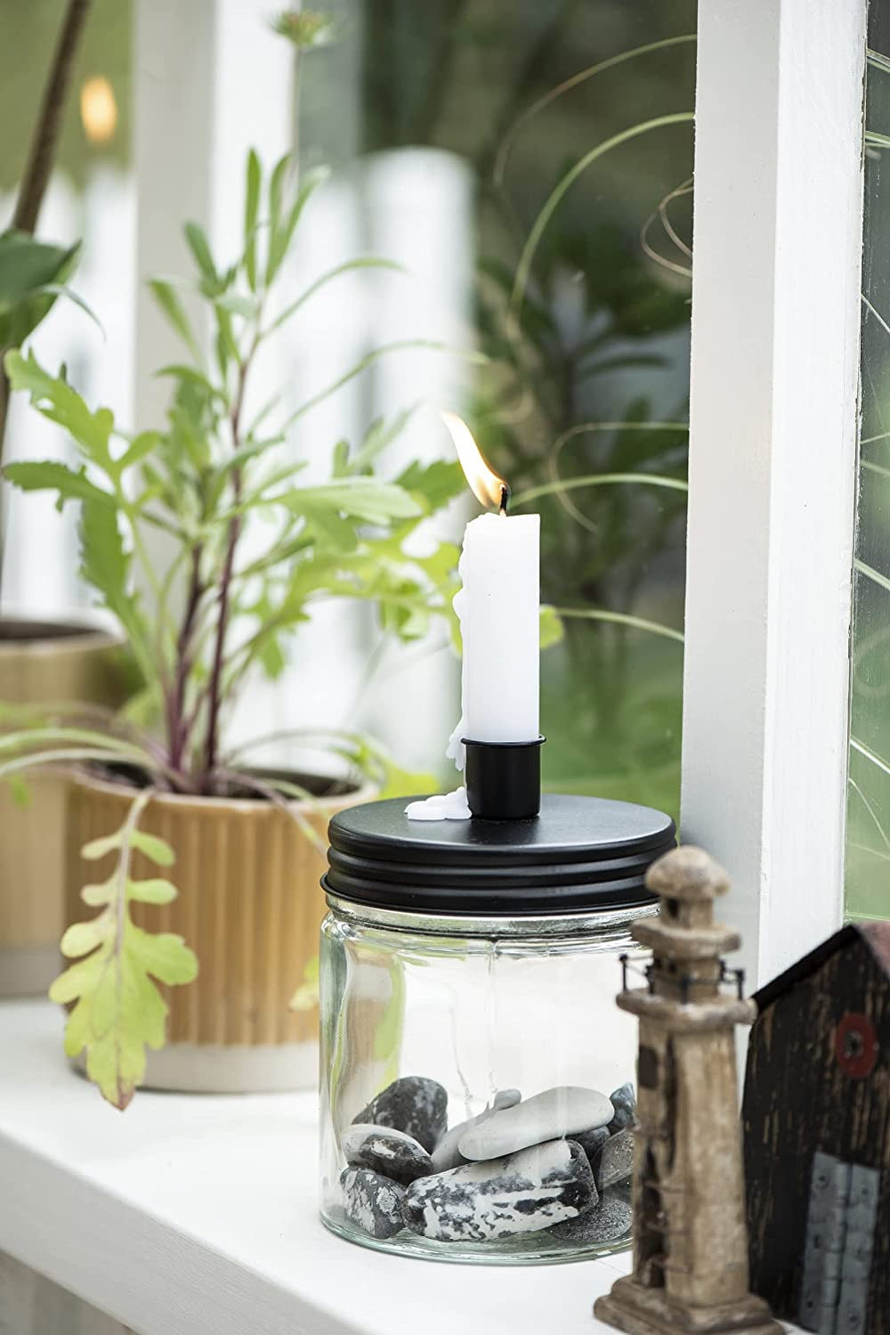 Black metal candle holder with a lid by IB Laursen, featuring a sleek design suitable for decorative or functional use.