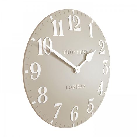 20-inch Arabic wall clock with sandy-colored face and black numerals, designed for home decor by Cornucopia Home and Gift.