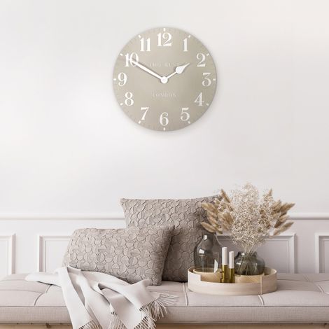 20-inch Arabic wall clock with sand-colored face and black numerals, designed by Cornucopia Home and Gift for stylish home decor.