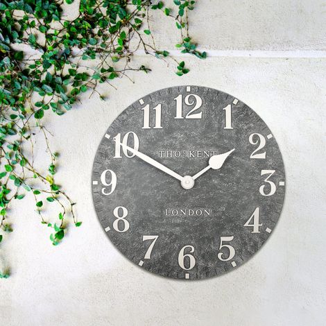20-inch outdoor Arabic wall clock made of cement by Cornucopia Home and Gift, featuring bold Arabic numerals and a rustic design.