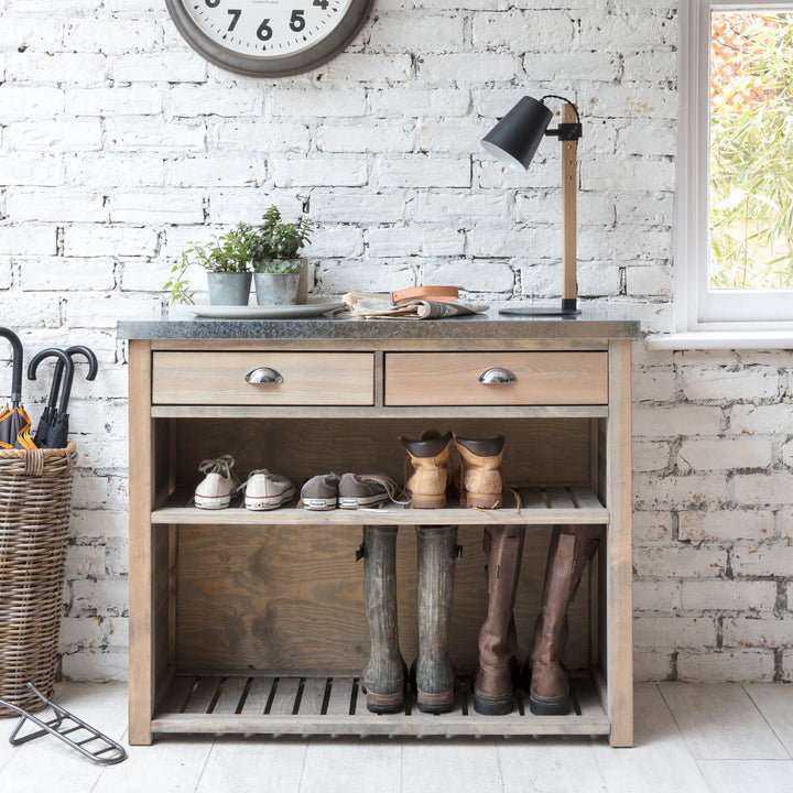 A garden Trading Aldsworth Bootroom Unit with storage shelves and hooks, made of wood in a modern, rustic design.
