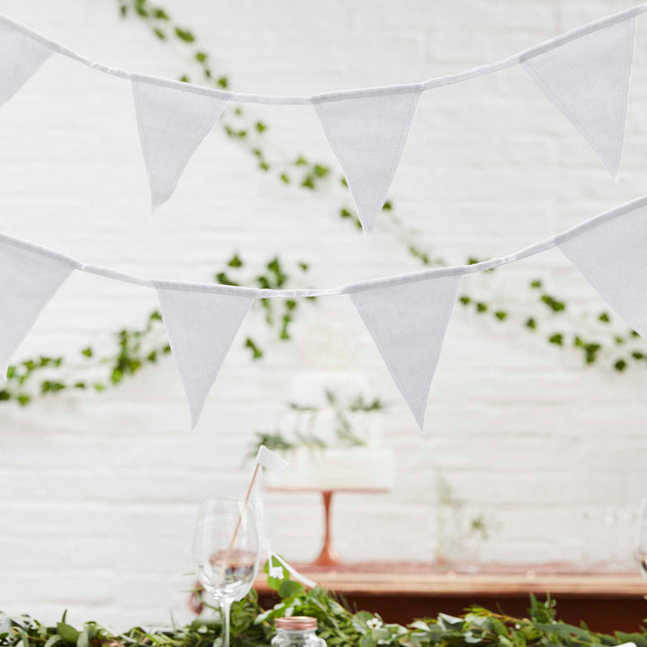 White fabric bunting by Ginger Ray, featuring soft fabric flags strung on a white cord, ideal for festive decorations.