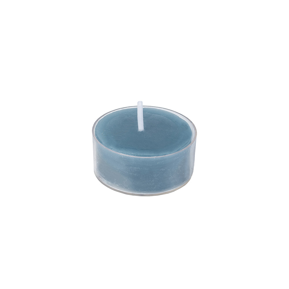Rustic tealights in petrol blue from Grand Illusions by Cornucopia Worcester, displayed in a natural setting.