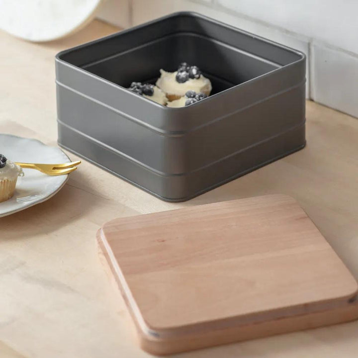 Charcoal Borough Cake Tin by Garden Trading featuring a sleek, round metal design with a lid for storing baked goods.