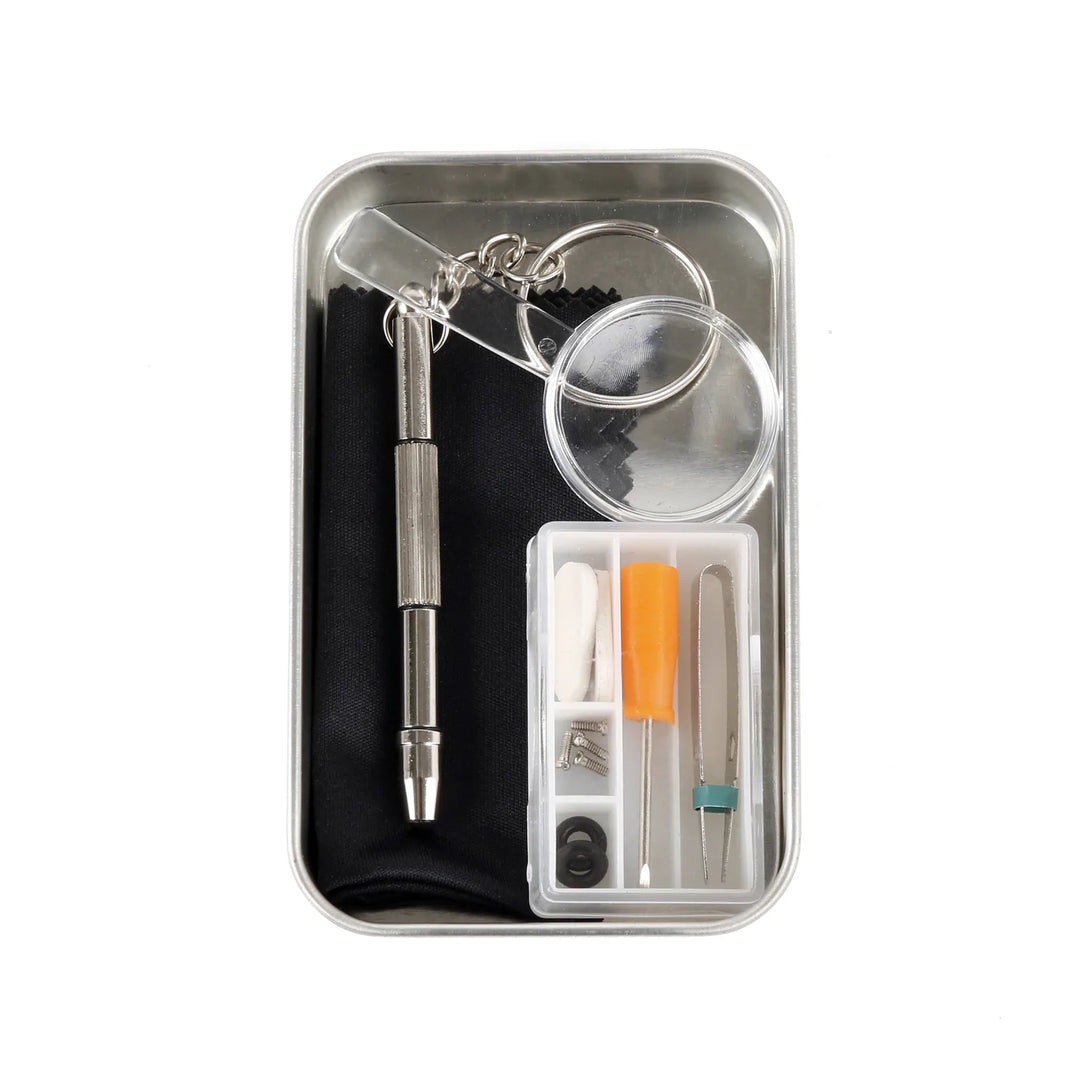 Kikkerland eyeglass repair kit in a compact tin, includes small tools and screws for fixing glasses, ideal for quick repairs
