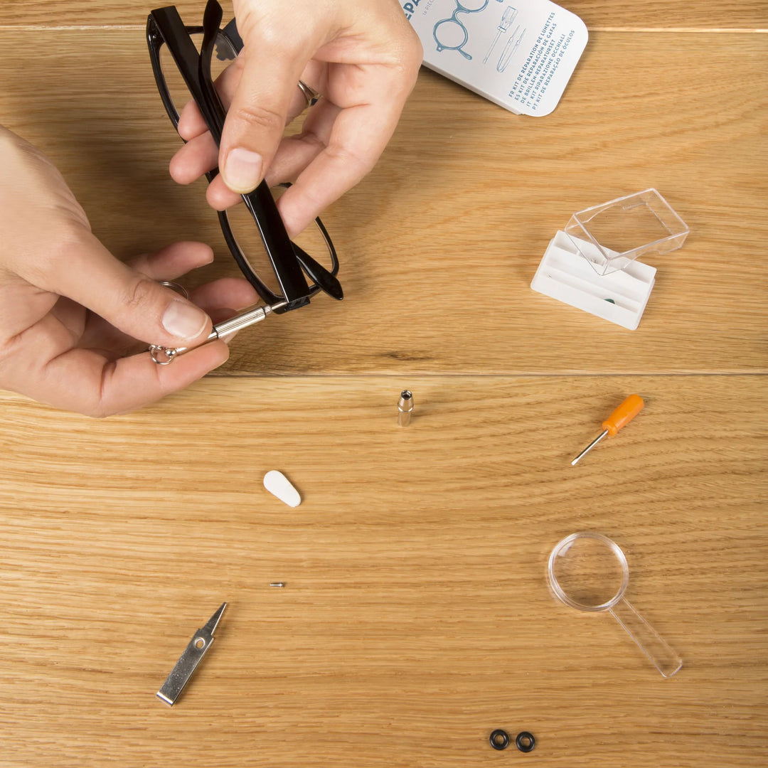 Kikkerland Cornucopia Home and Gift eyeglass repair kit in a compact tin with small tools for fixing glasses.